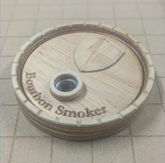 Bourbon Smoker CNC lid with layered wood stock and crest design