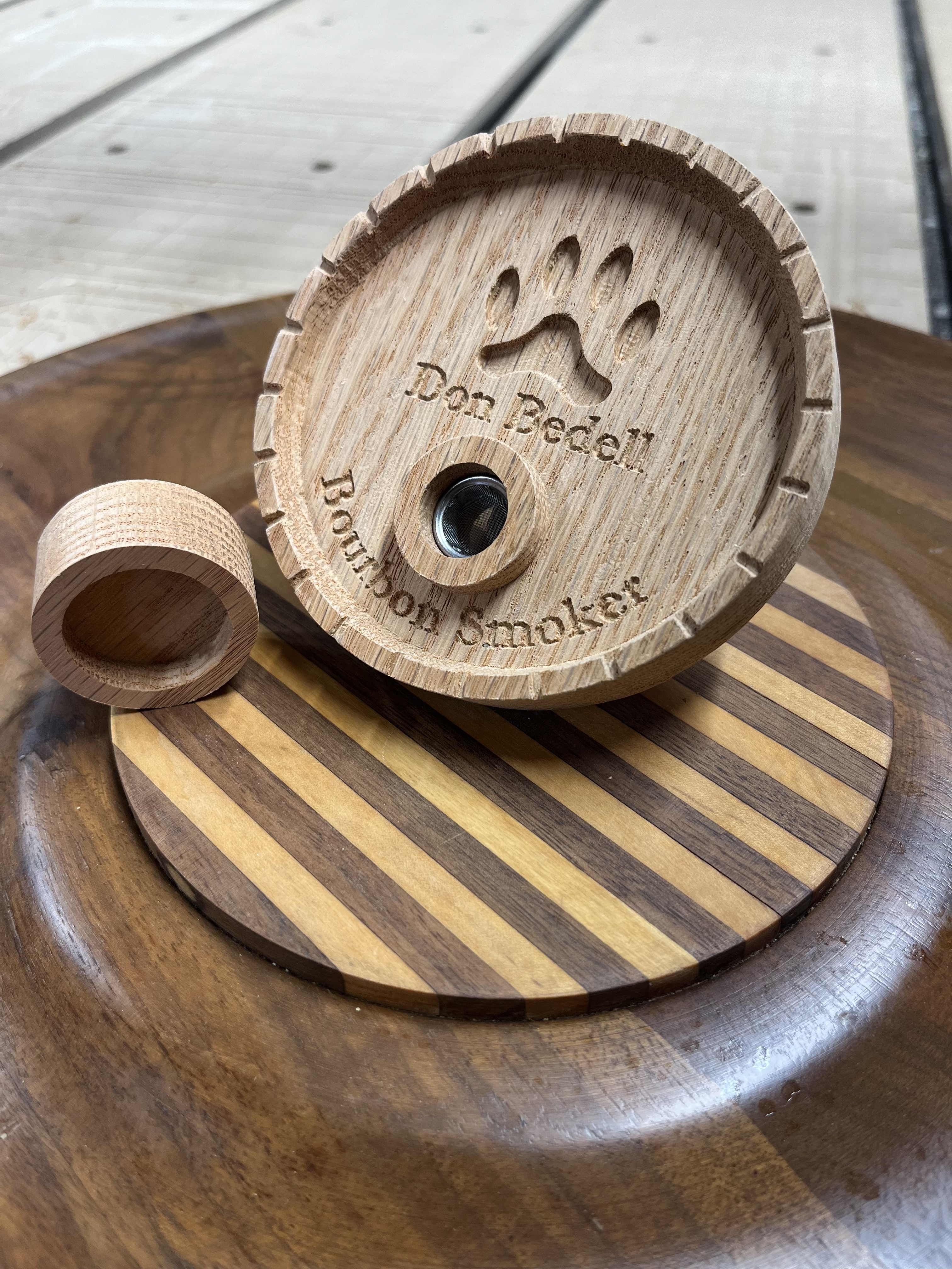 Bourbon smoker CNC lid with intricate wood grain and precision machining
