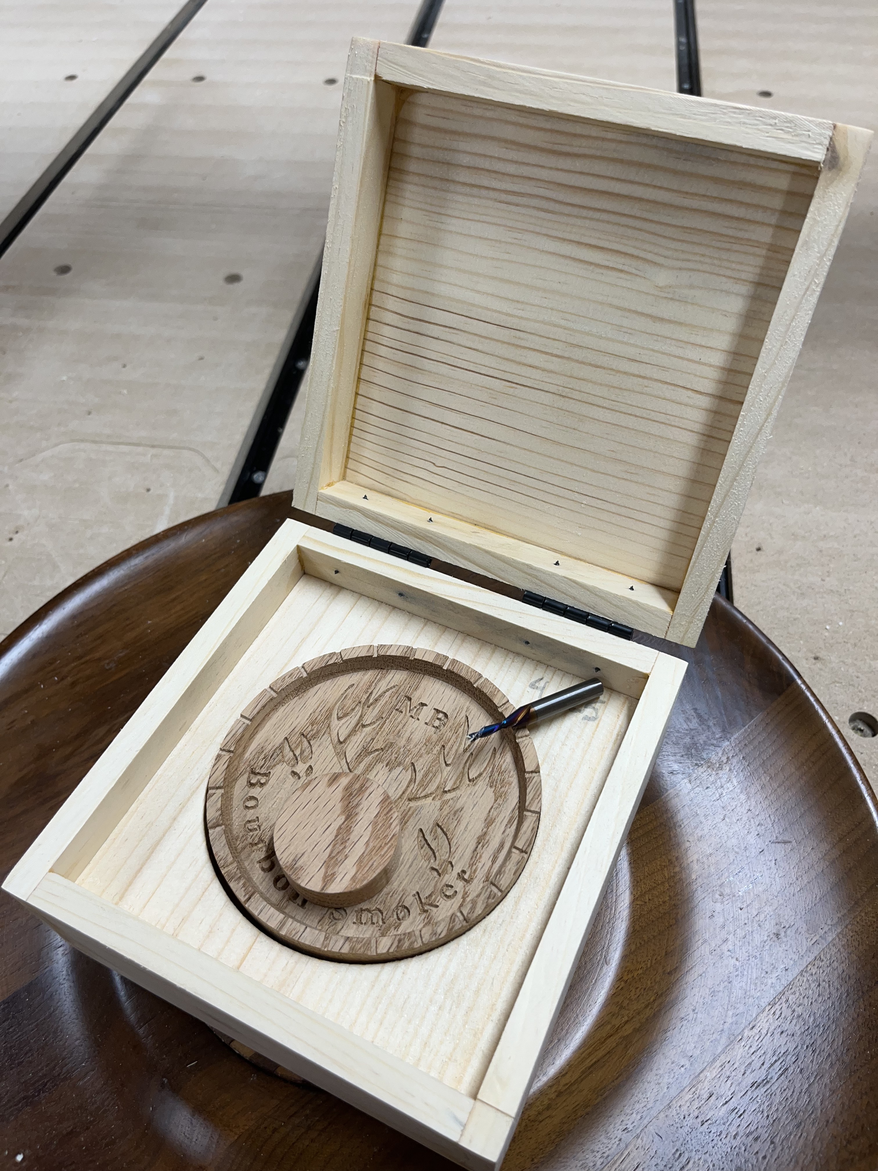 Bourbon smoker CNC lid showcasing detailed engraving and craftsmanship